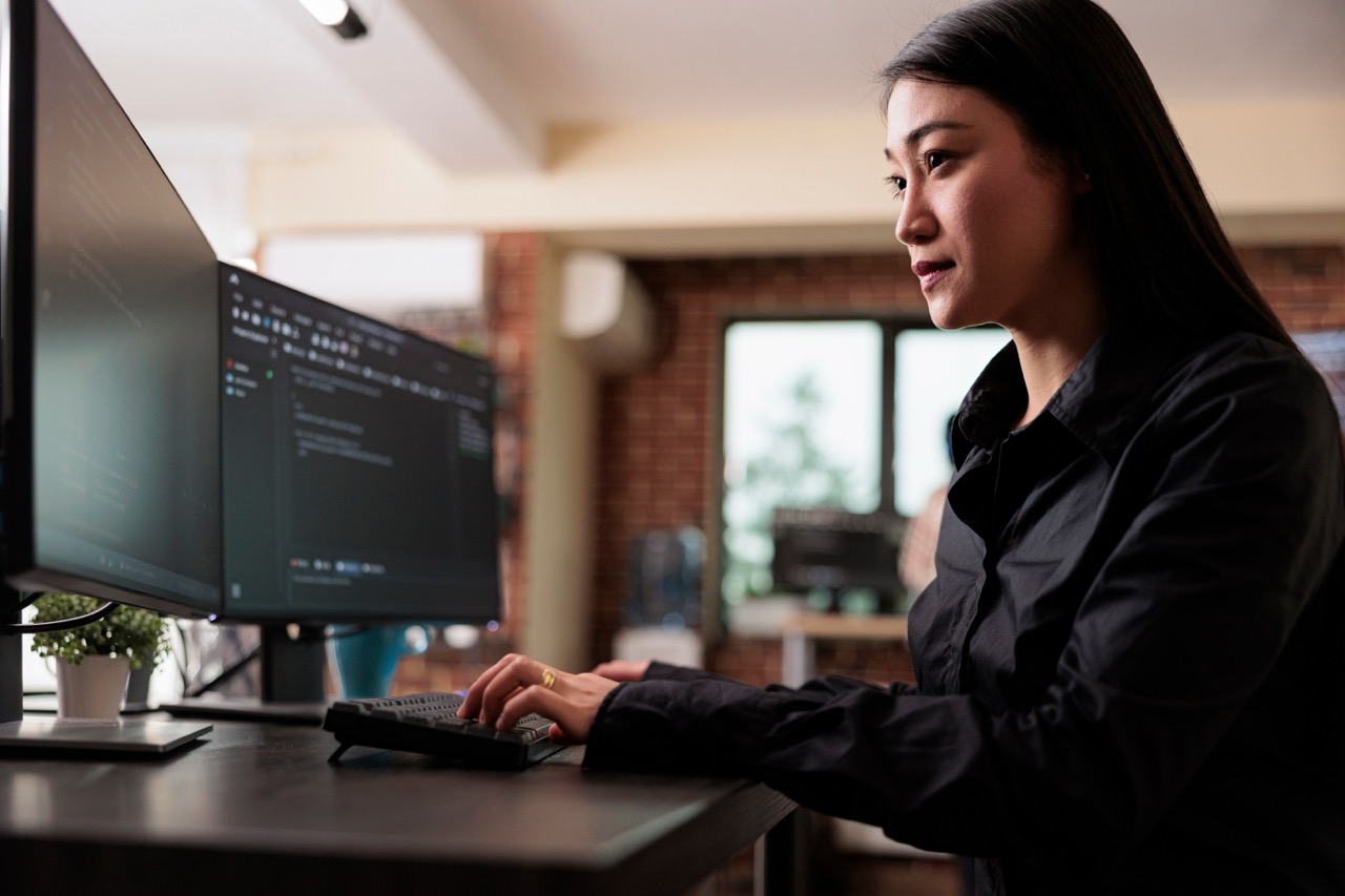 Woman looking at screen, typing