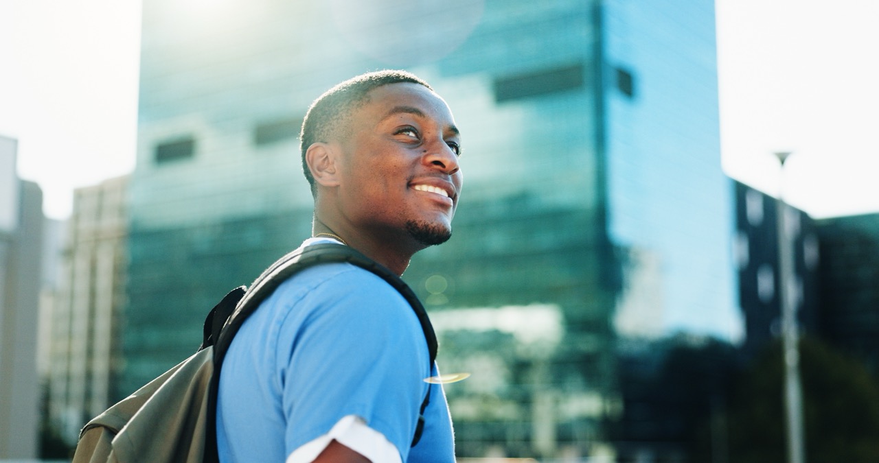 Man walking in the city wearing for backpack